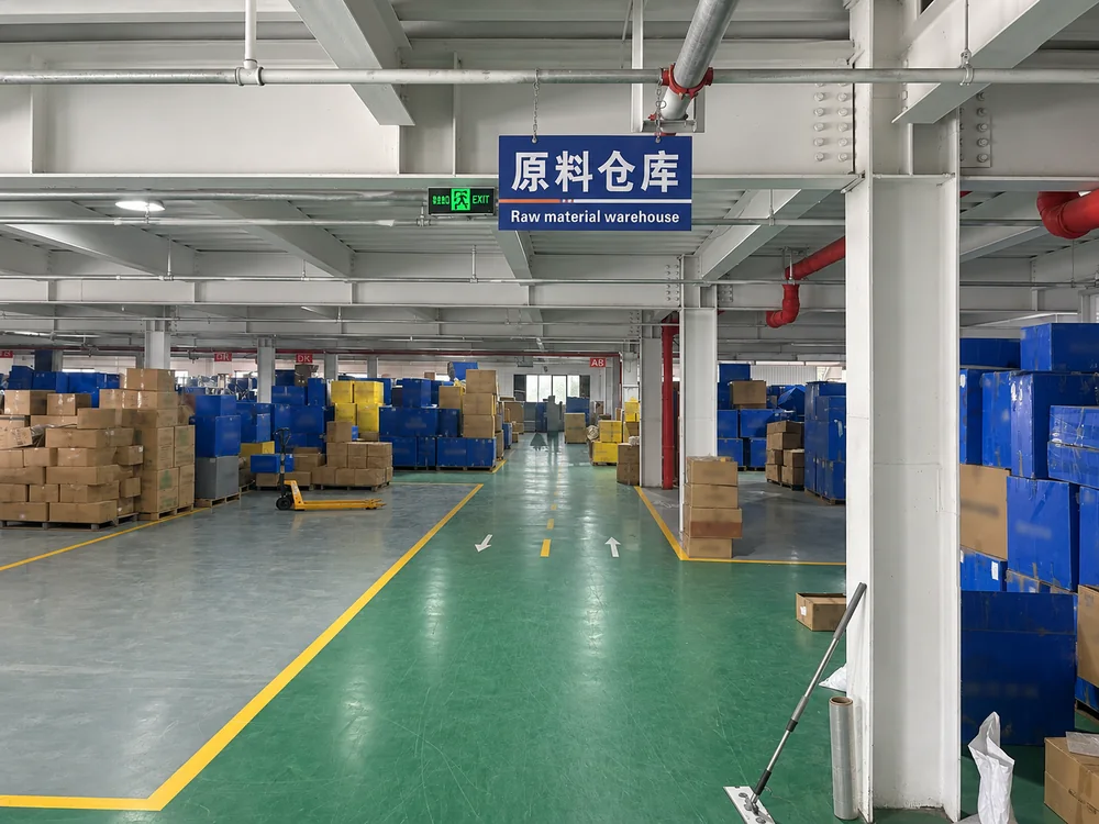 JINJIE raw material warehouse with marked floor lanes and stored containers