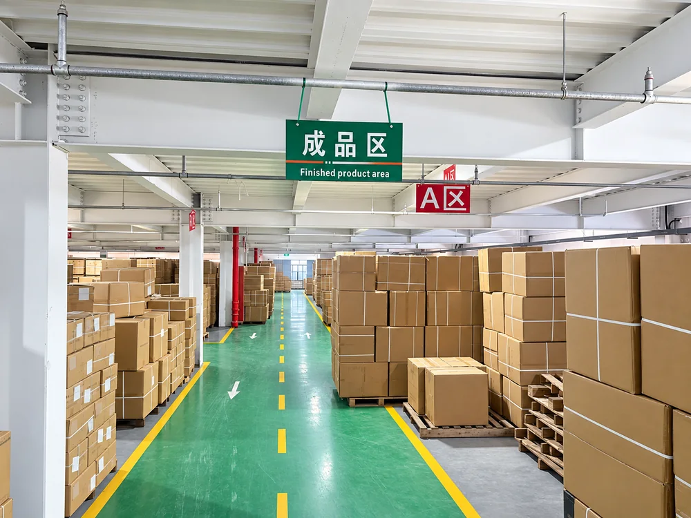 Marked finished-goods area with cartons and a central aisle