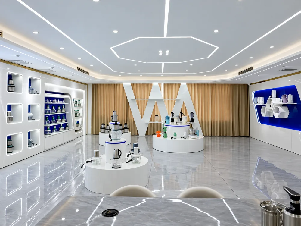 JINJIE showroom with appliance displays and illuminated shelving..