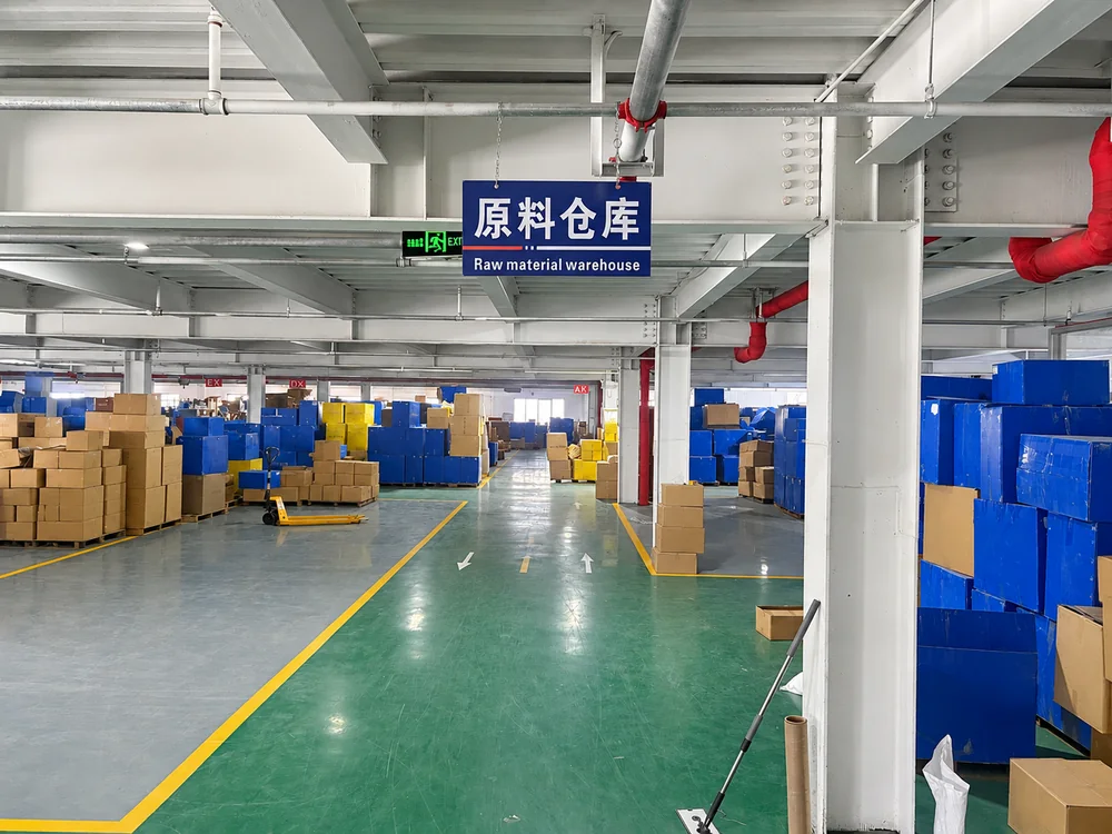 Raw-material warehouse with boxes, bins and marked aisles