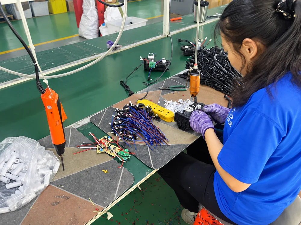 Worker assembling wired appliance components