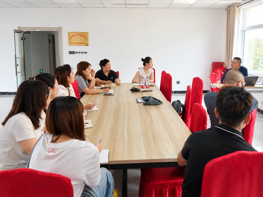 Staff meeting around a long table