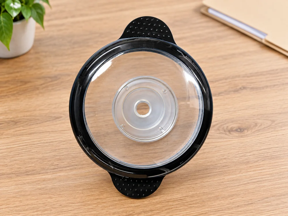 Transparent chopper lid on a wooden sample-review surface