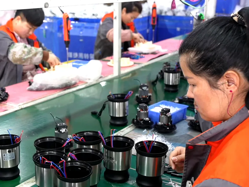 Motor housings and components at assembly workstations.