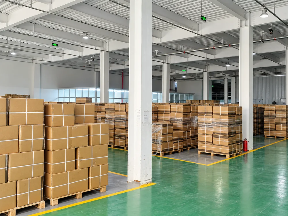 Cartons on pallets inside the finished-goods warehouse